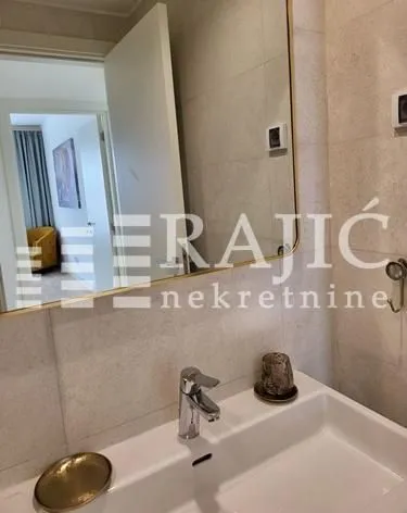 Modern bathroom with a sink and mirror.