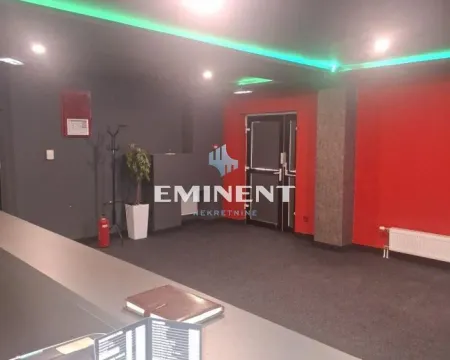 Interior space with red walls and a suspended ceiling with lighting. - image 10