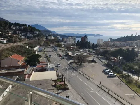 View from the terrace overlooking the city, street, and sea. - image 10