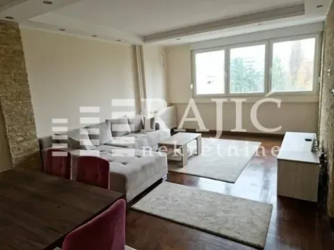Spacious living room with a sofa set and dining area. - image 4