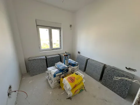 Empty room during renovation with construction materials. - image 7