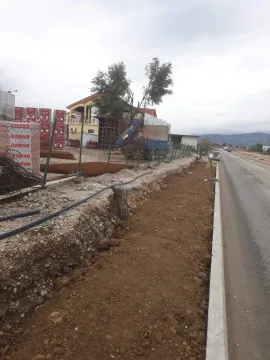 Construction plot next to the road with building materials. - image 3