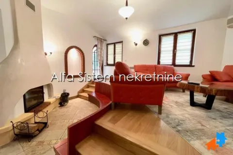 Living room with a fireplace and seating furniture. - image 9