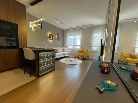 Modern open-plan space combining the living room, dining area, and kitchen. - image 2