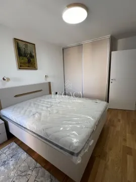 Furnished bedroom with a double bed and a fitted wardrobe. - image 11
