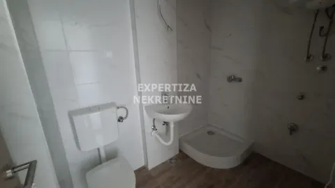 Smaller bathroom with sanitary ware and a shower cabin. - image 6