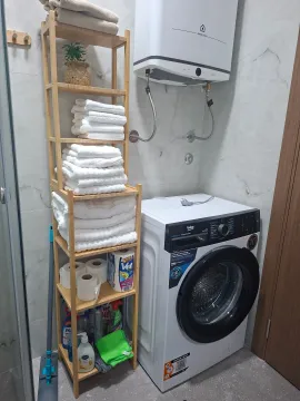 Bathroom with a washing machine. - image 5