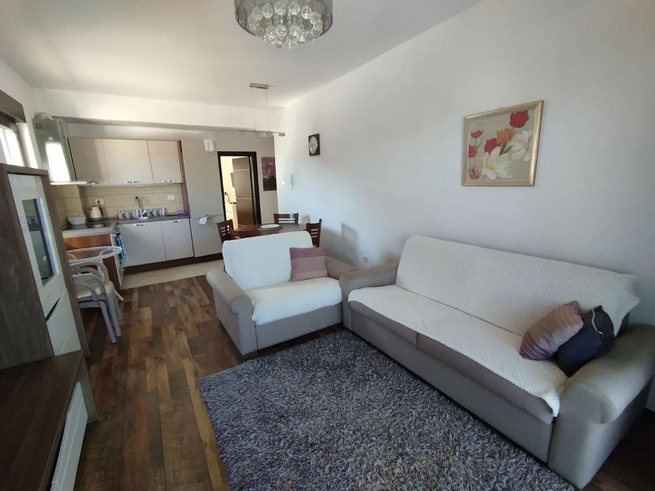 Living room connected to the dining area and kitchen.