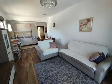 Living room connected to the dining area and kitchen. - image 3