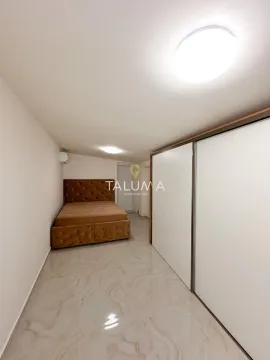 Bedroom with a double bed and a built-in wardrobe. - image 15