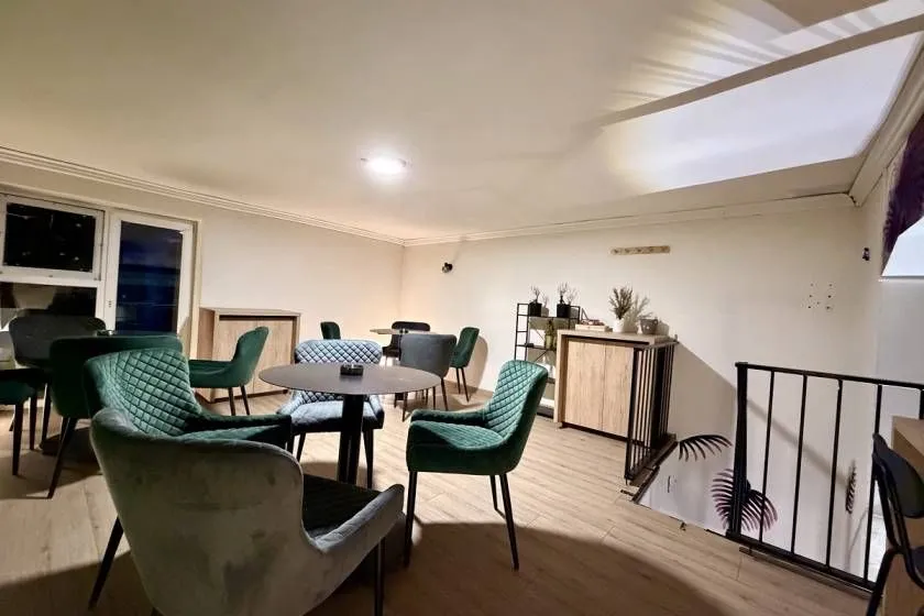 Living room furnished with a dining table and chairs.