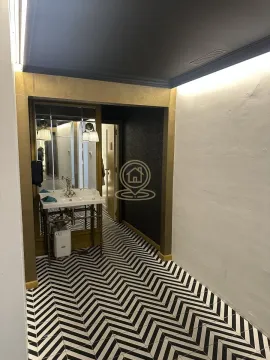Small bathroom with a washbasin, mirror and black and white floor tiles. - image 13