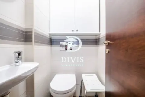 Small bathroom with a sink, toilet, and wall cabinet. - image 10