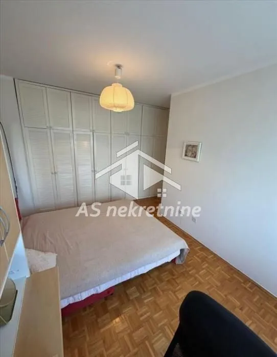 Bedroom with a double bed and a built-in wardrobe.