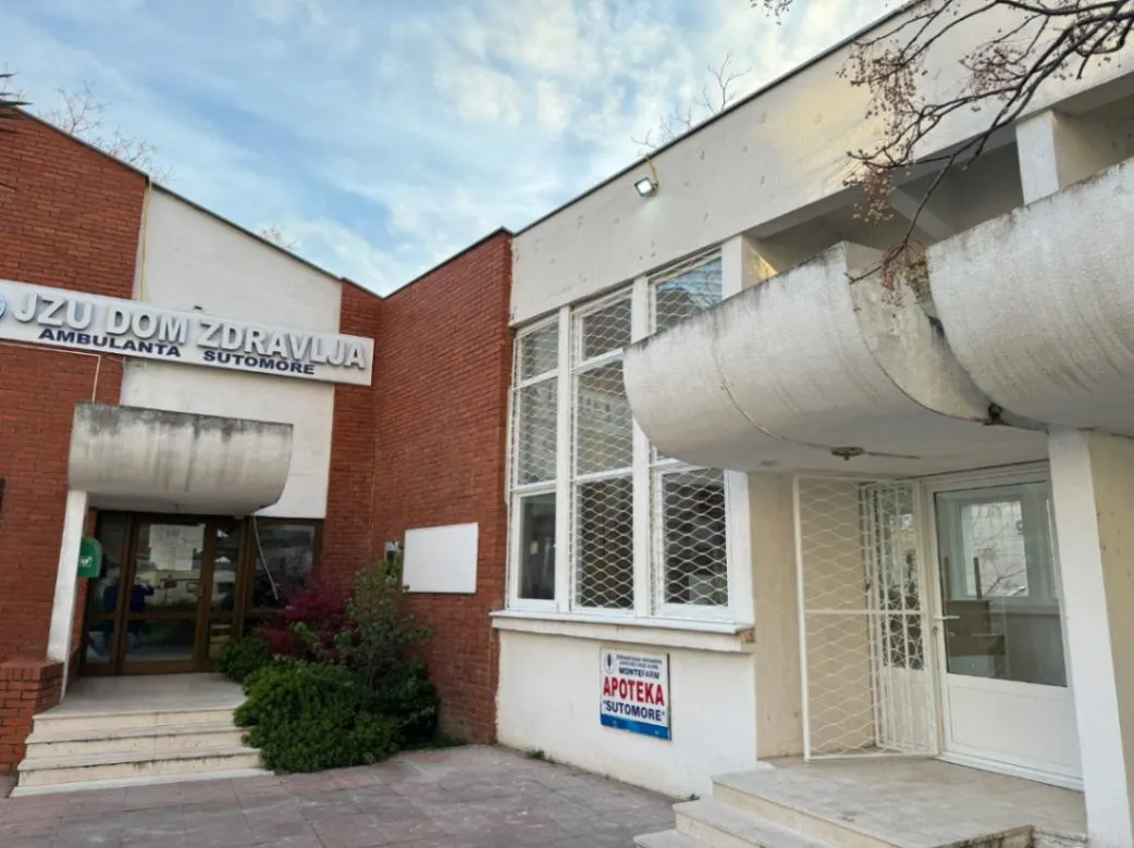 Exterior of the commercial building with entrance and stairs.