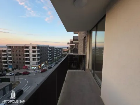 Spacious balcony with a view of the neighborhood and street. - image 9