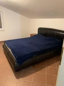 Bedroom with a double bed and tiled flooring. - image 12