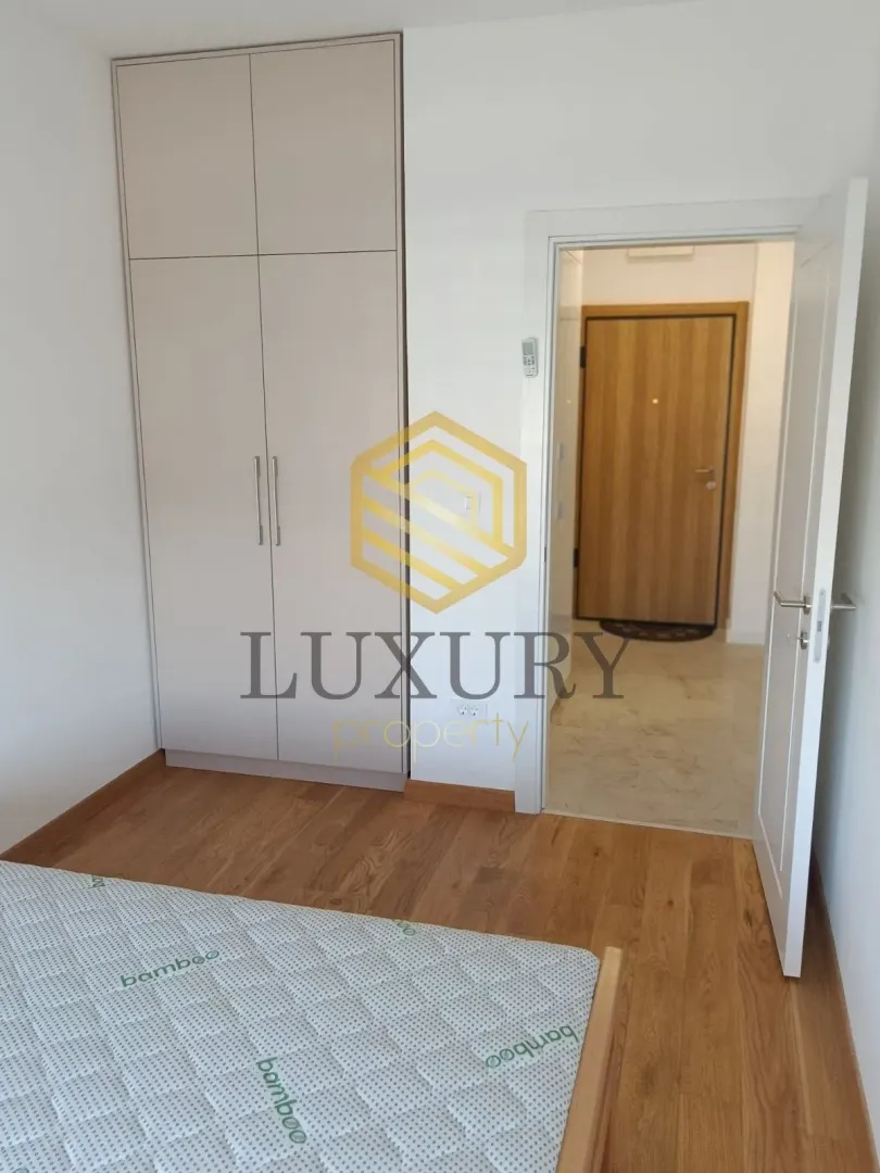 Bedroom with a wardrobe and a bed.