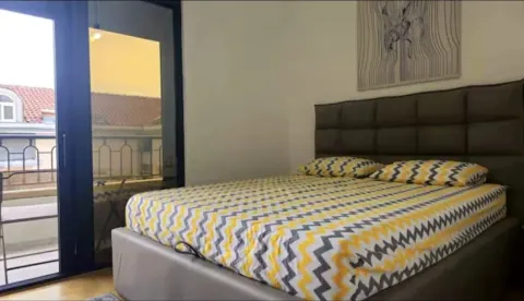 Furnished bedroom with a double bed and access to the terrace. - image 5