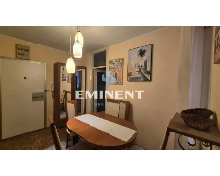 Dining area with a wooden table and chairs. - image 5