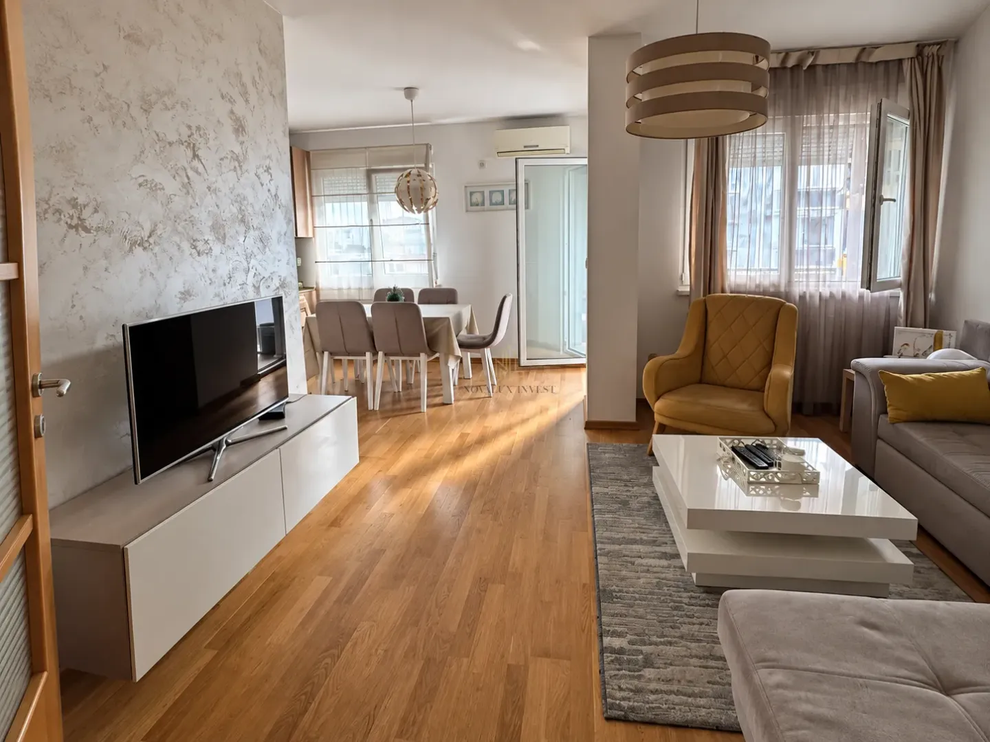 Spacious living room connected with the dining area and kitchen.
