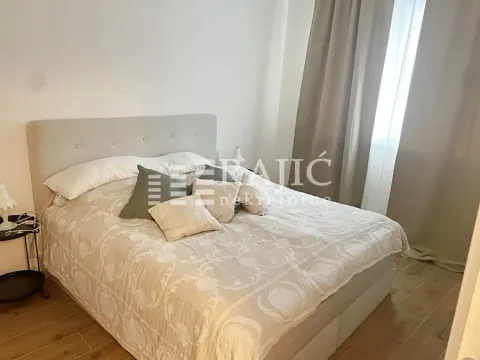 Furnished bedroom with a double bed. - image 3