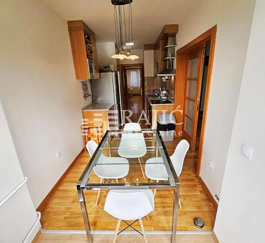 Smaller kitchen with a dining table and chairs.