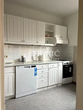 Small kitchen with white cabinetry and white appliances. - image 10