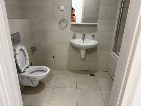 Modern bathroom with sanitary ware and a shower cabin. - image 4