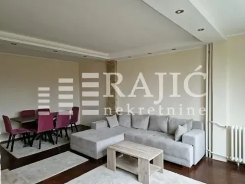 Living room with sofa set and dining area. - image 2