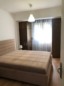 Furnished bedroom with a double bed, wardrobes, and a window. - image 6