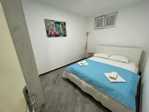 Smaller bedroom with a double bed and a picture on the wall. - image 5