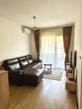 Living room with a sofa and access to the terrace. - image 5