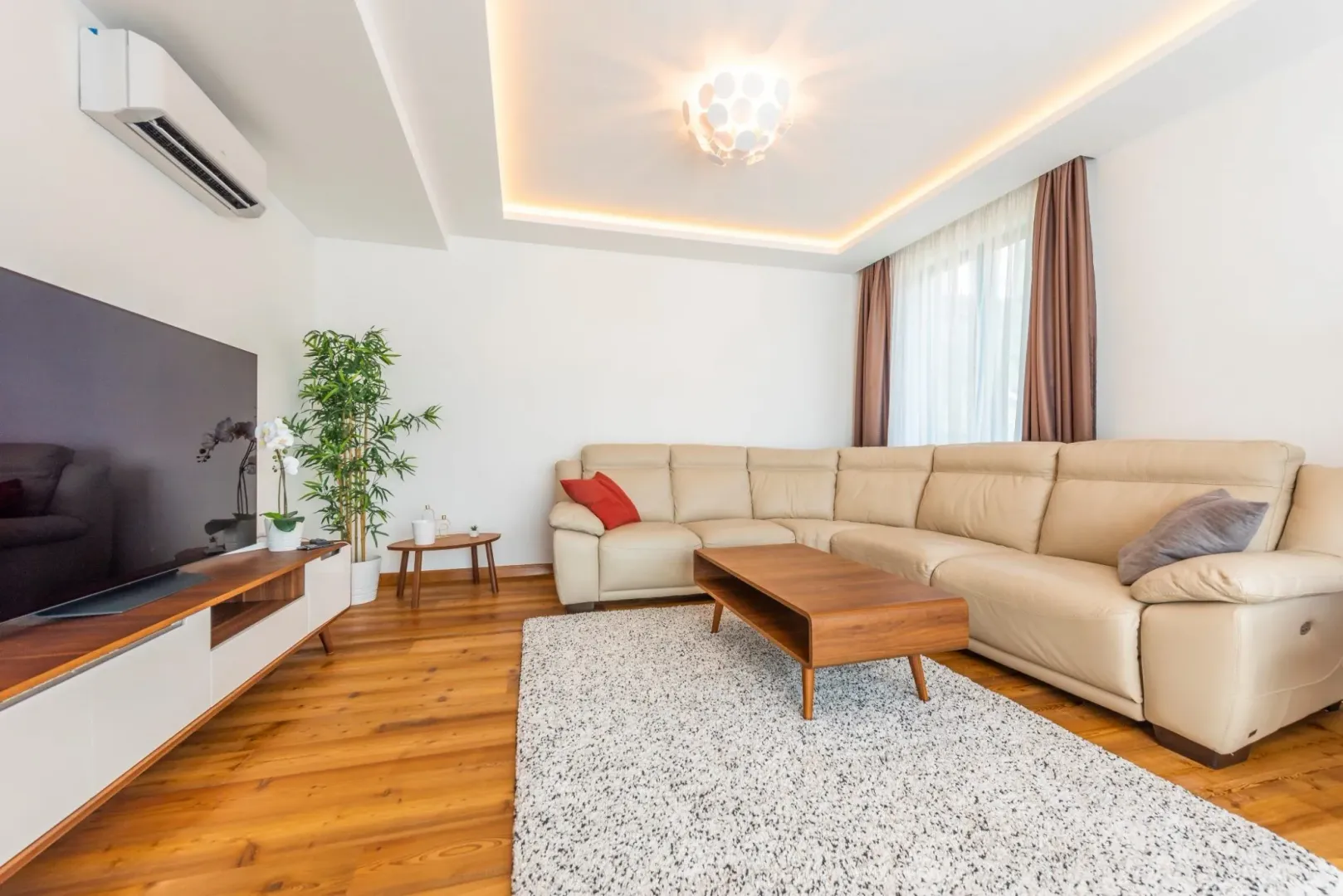 Bright living room with a sectional sofa.