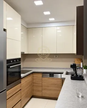 Modern kitchen with built-in cabinetry and appliances. - image 6