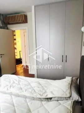 Bedroom with a double bed and a fitted wardrobe. - image 15