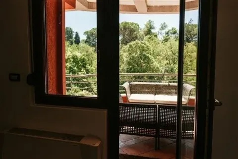 View of a terrace with outdoor seating. - image 10