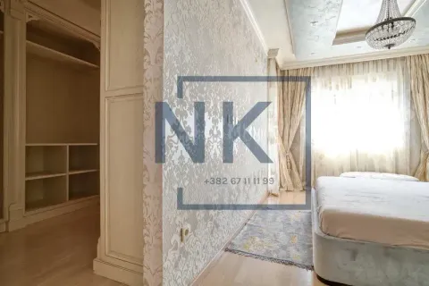 Bedroom with a double bed and built-in wardrobes. - image 8