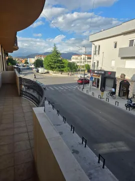 View from the terrace overlooking the city street and surrounding buildings. - image 6