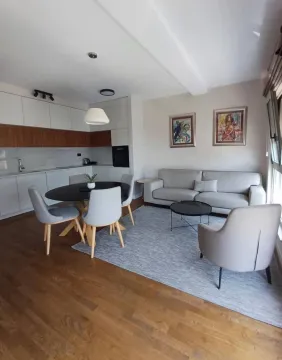 Living room with dining area and open-plan kitchen. - image 4