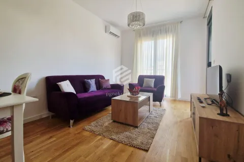 Living room with a sofa set and a television. - image 13