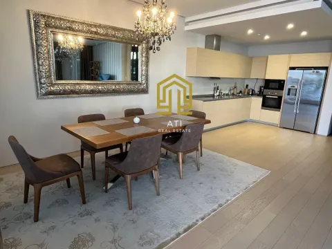 Living room with dining area and kitchen in the background. - image 5