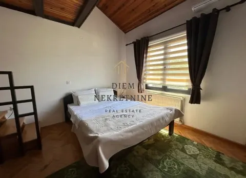 Bedroom with a double bed, wooden ceiling, and a window. - image 5