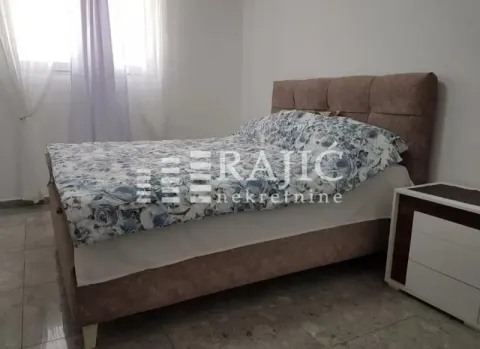 Furnished bedroom with a double bed and a nightstand. - image 6