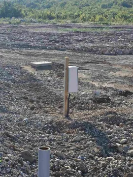 Building plot with an installed electricity connection box. - image 12