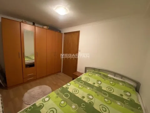 Furnished bedroom with a large wardrobe and a double bed. - image 5