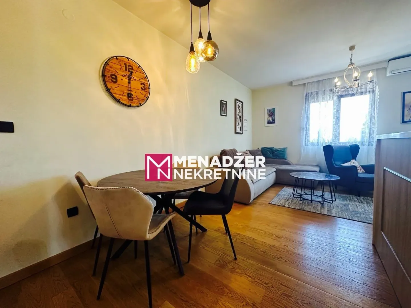 Living room with dining area and sofa set.