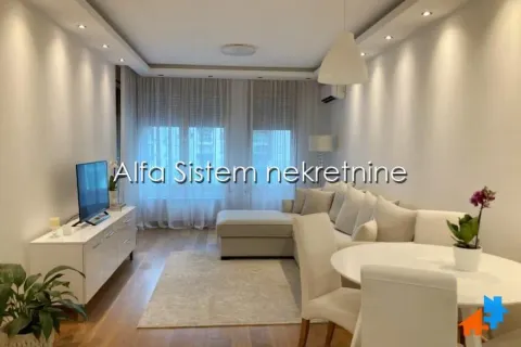 Living room with sofa, TV unit and dining table. - image 2