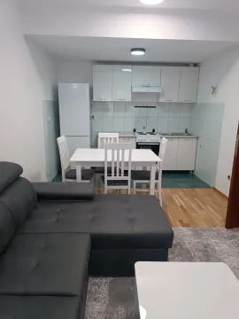 Living room with kitchen and dining area. - image 2