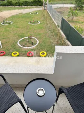 View from the balcony overlooking the lawn yard. - image 7